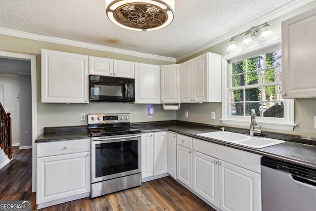 kitchen featuring sink, white cabinets, a textured ceiling, dark hardwood / wood-style floors, and appliances with stainless steel finishes