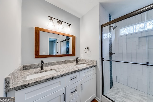 bathroom with vanity and walk in shower