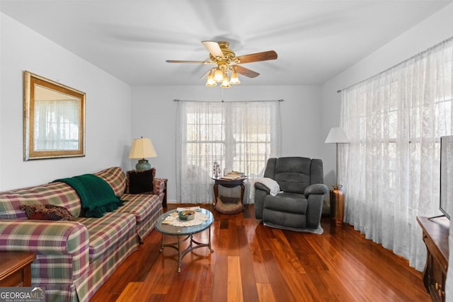 living room featuring ceiling fan and hardwood / wood-style floors