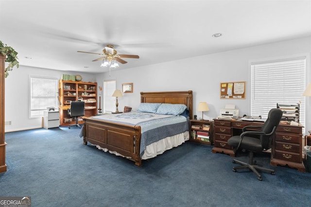 bedroom featuring ceiling fan and dark colored carpet