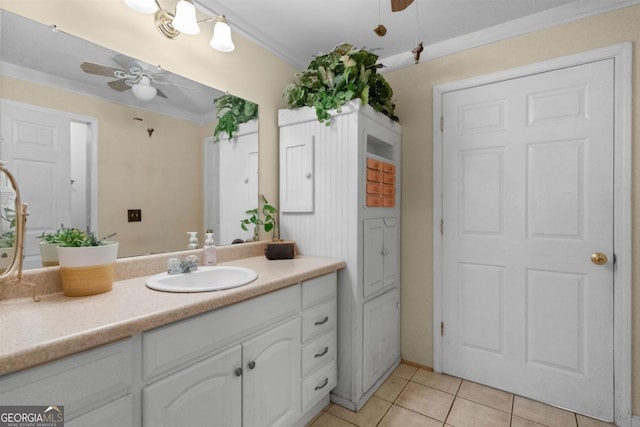 bathroom featuring ceiling fan, vanity, crown molding, and tile patterned floors