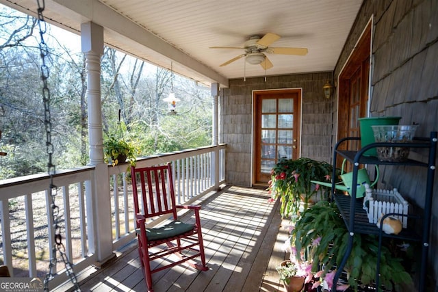 deck with a porch and ceiling fan