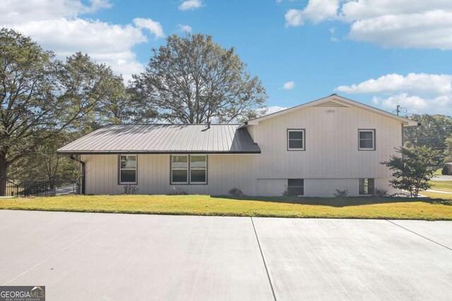 view of home's exterior with a yard