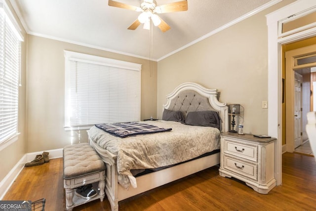 bedroom with ceiling fan, crown molding, and dark hardwood / wood-style floors