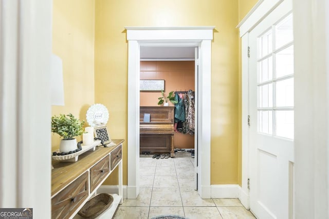 doorway featuring light tile patterned floors