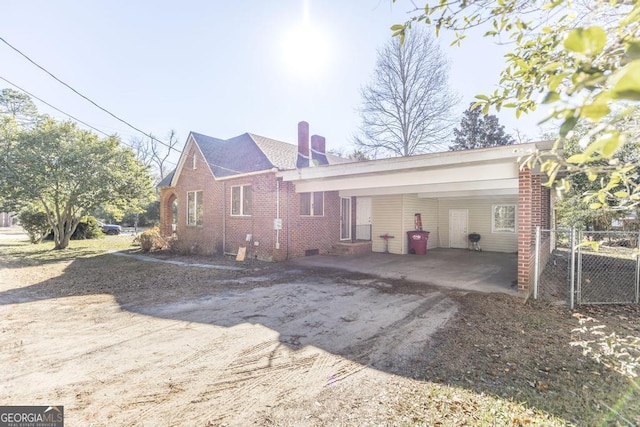 exterior space featuring a carport