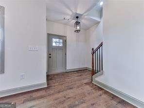 foyer entrance with dark hardwood / wood-style floors