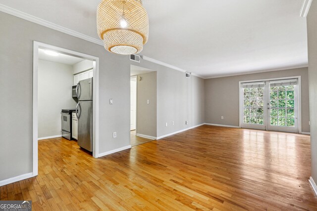 interior space with crown molding and light hardwood / wood-style floors