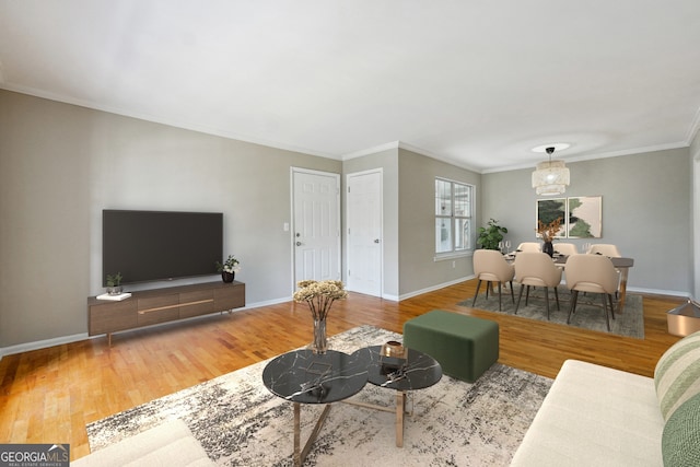 living room with hardwood / wood-style flooring and crown molding