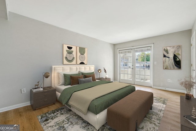 bedroom with french doors, wood-type flooring, and access to outside