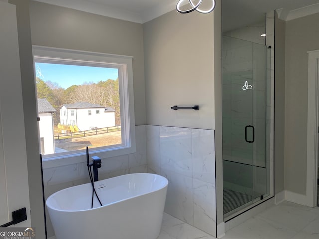 bathroom featuring shower with separate bathtub and crown molding