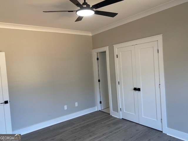 unfurnished bedroom featuring hardwood / wood-style floors, ceiling fan, and crown molding