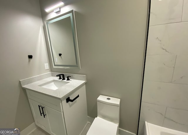 bathroom featuring toilet and vanity