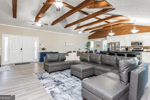 living room featuring an AC wall unit, ornamental molding, lofted ceiling with beams, and light wood-type flooring