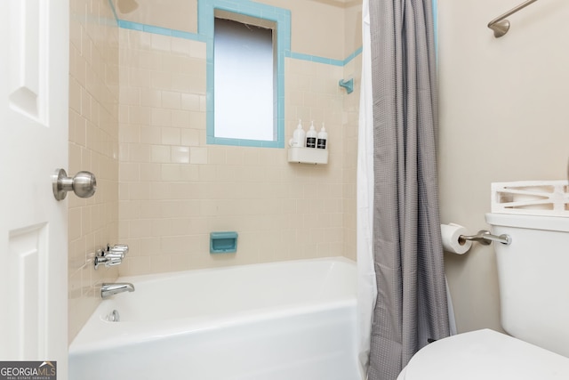 bathroom featuring toilet and shower / tub combo with curtain