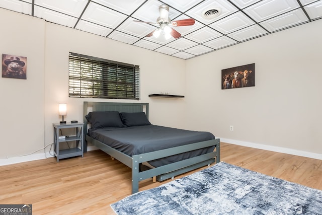 bedroom featuring ceiling fan and wood-type flooring