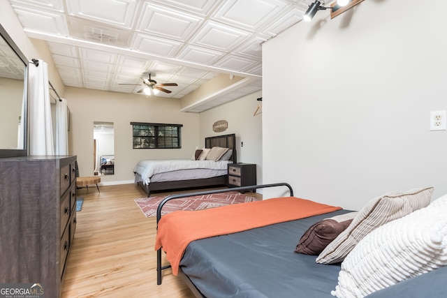 bedroom featuring ceiling fan and light hardwood / wood-style flooring