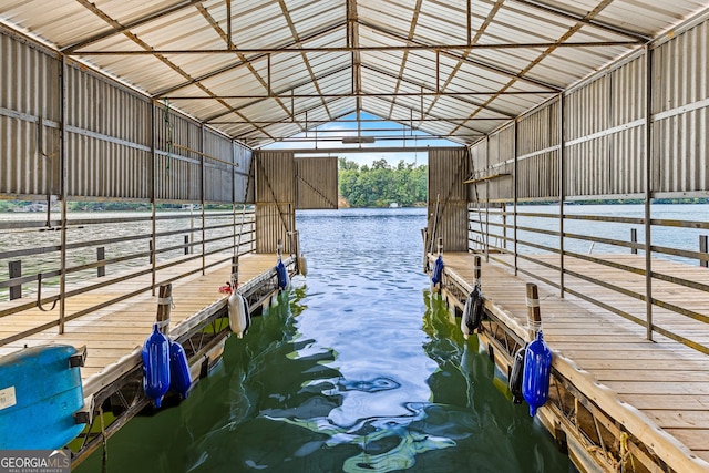 view of horse barn featuring a water view