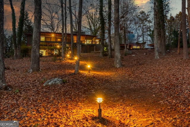 yard at dusk with a deck