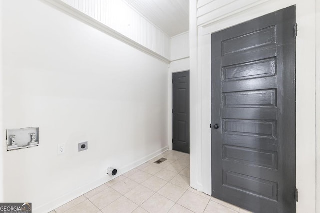 laundry room with electric dryer hookup, hookup for a washing machine, and light tile patterned floors