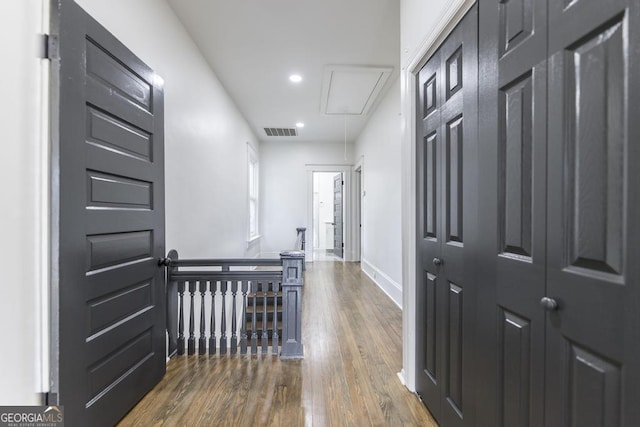 hall with hardwood / wood-style flooring