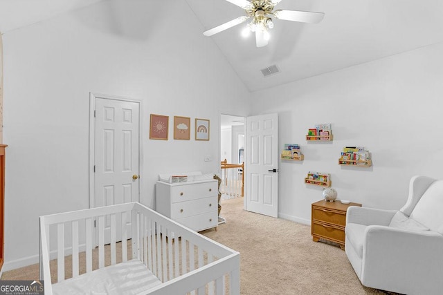 carpeted bedroom with a nursery area, high vaulted ceiling, and ceiling fan