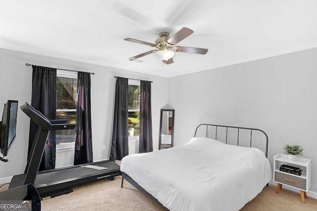 bedroom with ornamental molding, ceiling fan, and carpet flooring