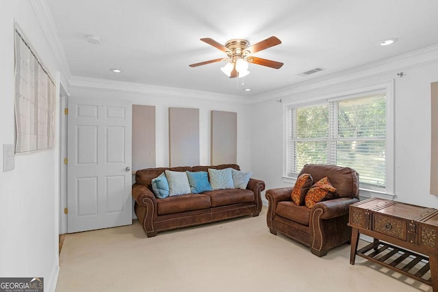 carpeted living room with ceiling fan and crown molding