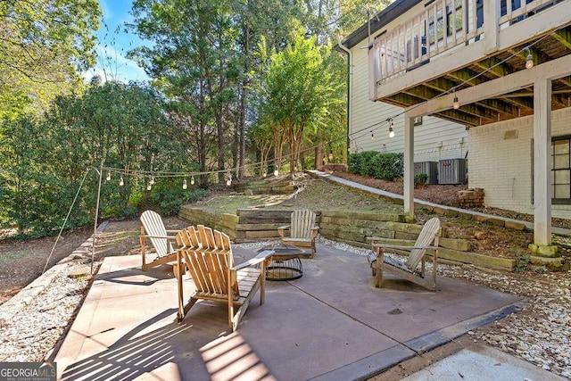 view of patio / terrace with an outdoor fire pit