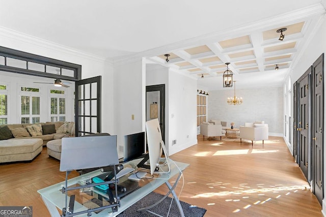 interior space featuring light hardwood / wood-style flooring, ceiling fan with notable chandelier, coffered ceiling, crown molding, and beam ceiling