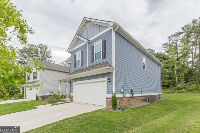 view of front of home with a front yard, a garage, and central AC unit