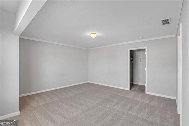 carpeted empty room with ornamental molding