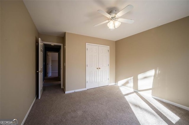 unfurnished bedroom featuring a closet, ceiling fan, and carpet floors