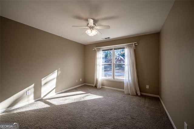 empty room with carpet floors and ceiling fan