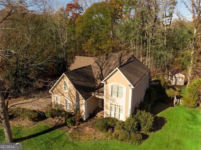 view of side of home featuring a yard