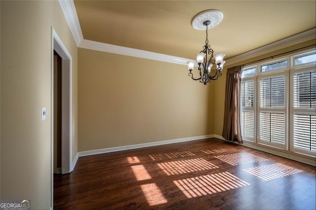 unfurnished room featuring ornamental molding, a chandelier, and dark hardwood / wood-style floors