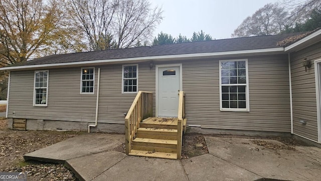 entrance to property with a patio area