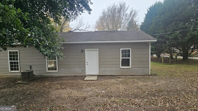 back of property featuring central AC unit