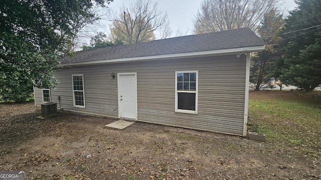 rear view of property featuring cooling unit