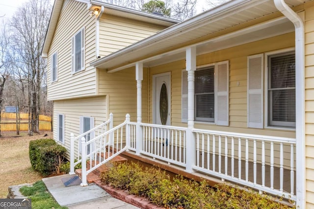 view of exterior entry with covered porch