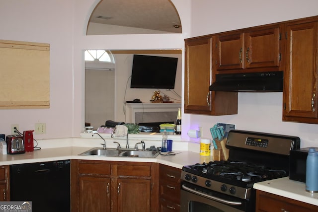 kitchen with stainless steel range with gas cooktop, black dishwasher, and sink