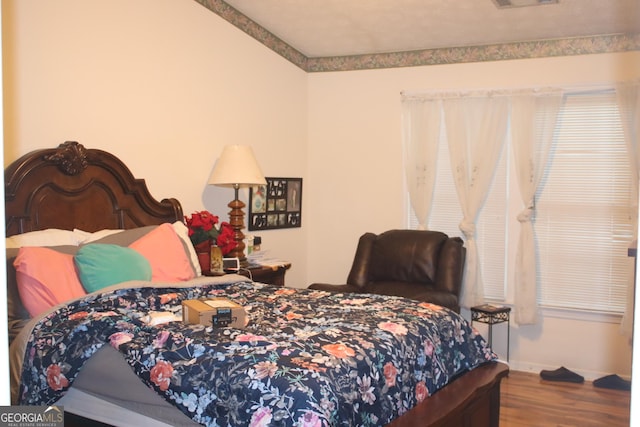 bedroom featuring wood-type flooring