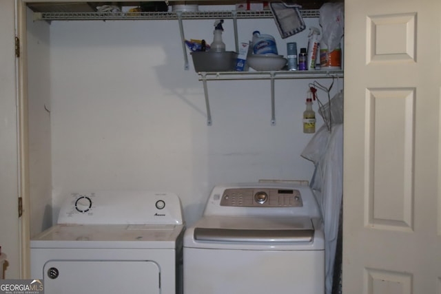 laundry room with independent washer and dryer