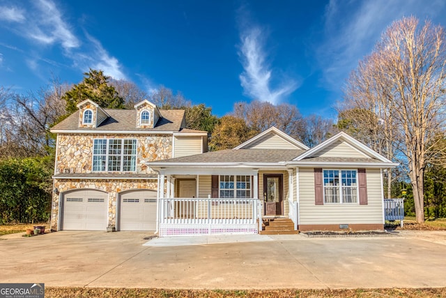 view of front of house with a garage and a porch