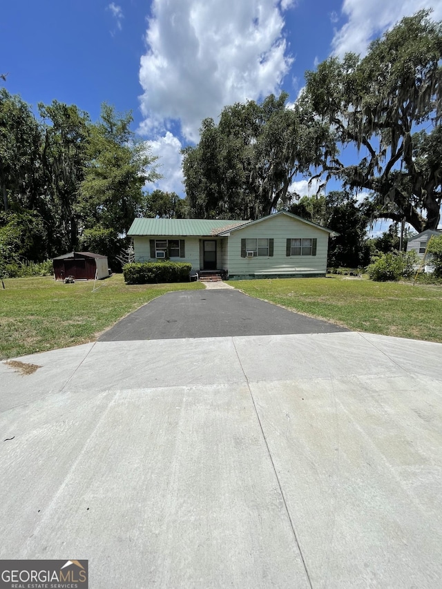 single story home with a carport and a front lawn