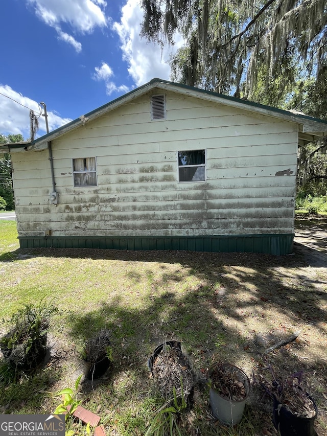 view of home's exterior featuring a lawn