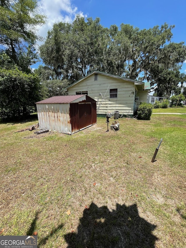 view of property exterior featuring a lawn and a shed