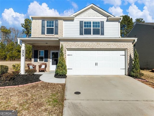 view of front of property with a garage and a porch