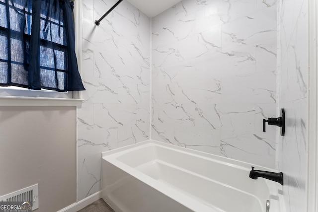 bathroom with shower / washtub combination