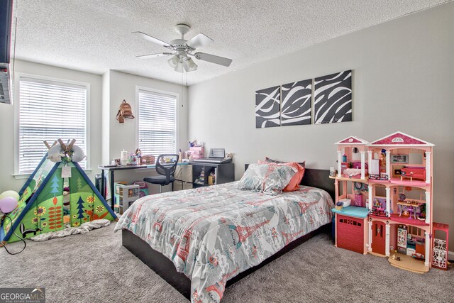 carpeted bedroom featuring a textured ceiling and ceiling fan